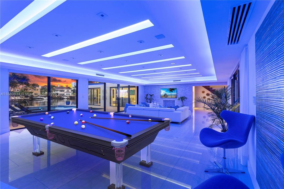 Game area illuminated with vibrant blue ambient LED lighting.