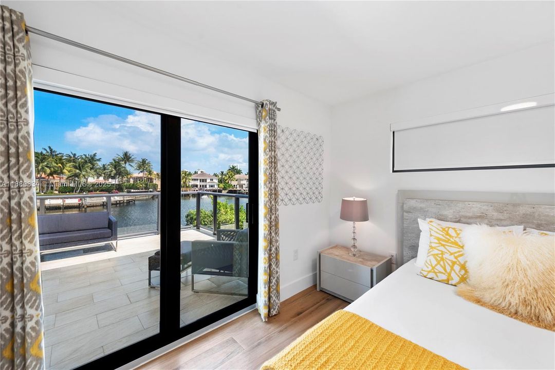 Bedroom featuring a sliding glass door to the balcony.