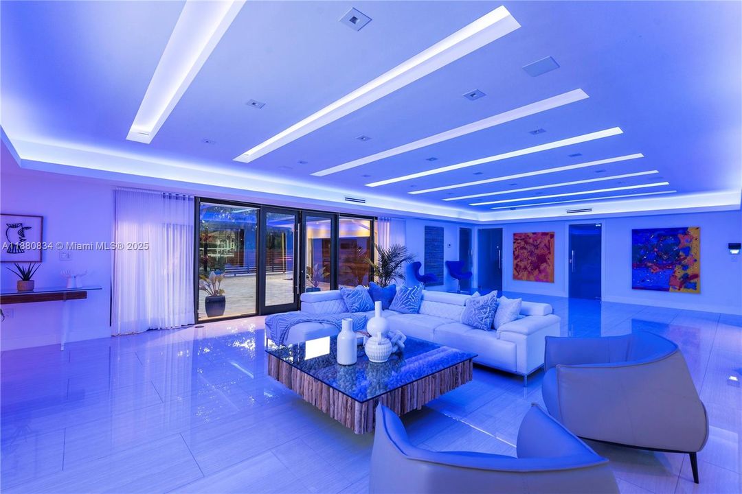 Modern lobby illuminated with dramatic blue LED lighting.