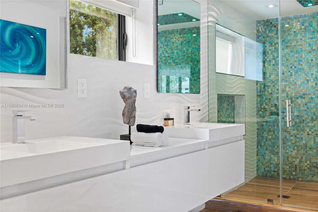 Stylish bathroom vanity set against a vibrant teal accent wall.