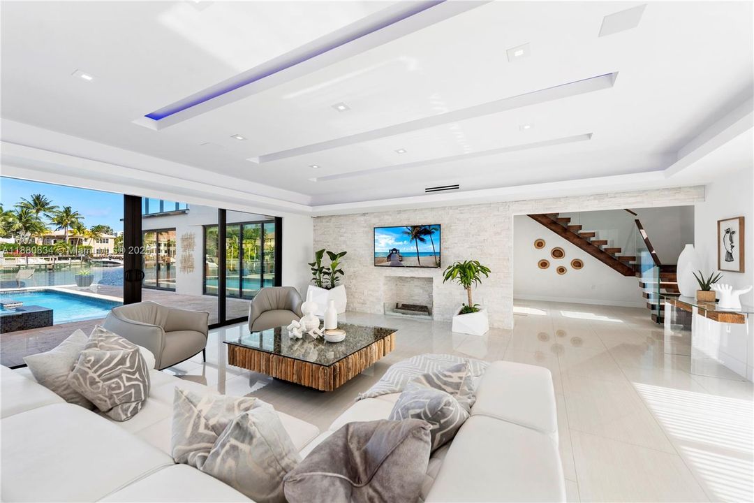 Open living space seamlessly connecting to the outdoor pool area.