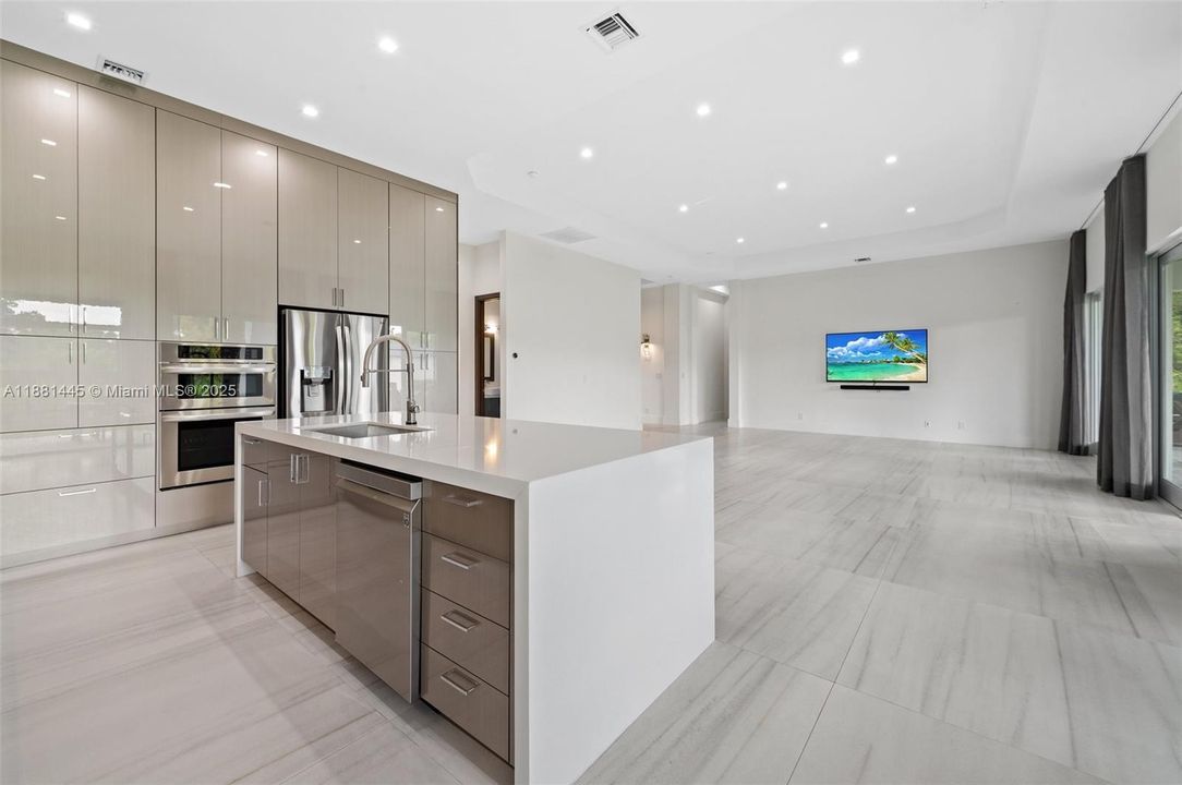 Grand Great Room with48” x 48” porcelain tile flooring throughout the home