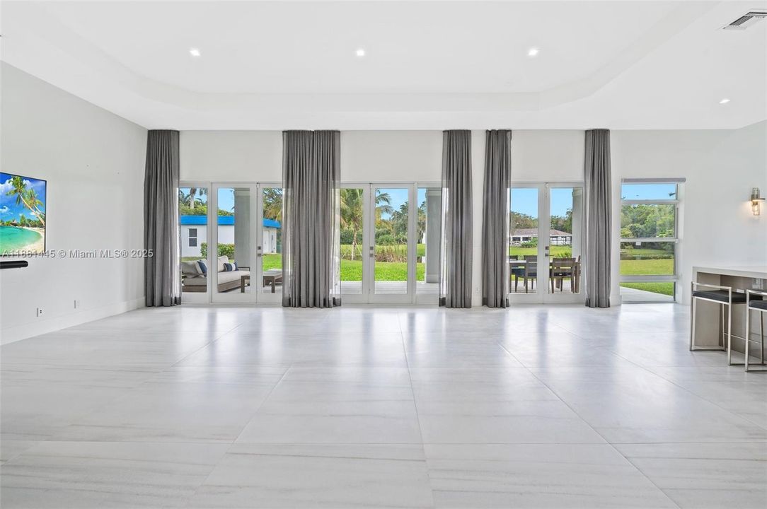 Grand Great Room has 3 sets of French Doors that lead to Covered Marble Patio