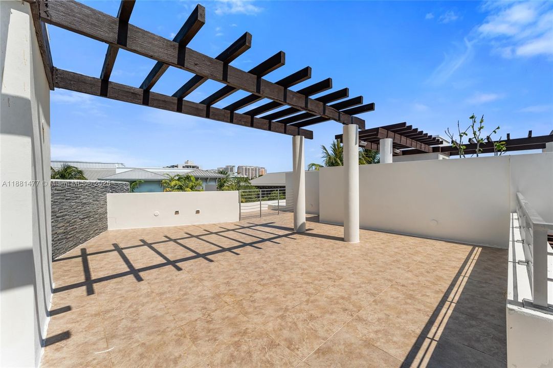 Sunlit Rooftop terrace with modern pergola Design.