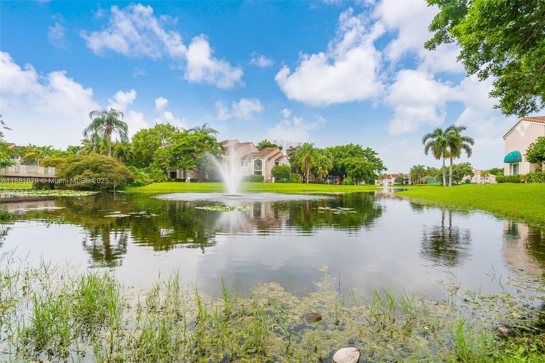 Community Lake with walking trail and pedestrian bridge