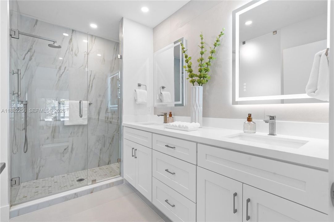 Double sink and shower in primary bathroom