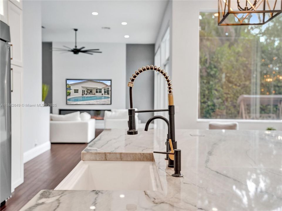 Deep farmhouse sink with architecturally designed faucet- no detail spared.