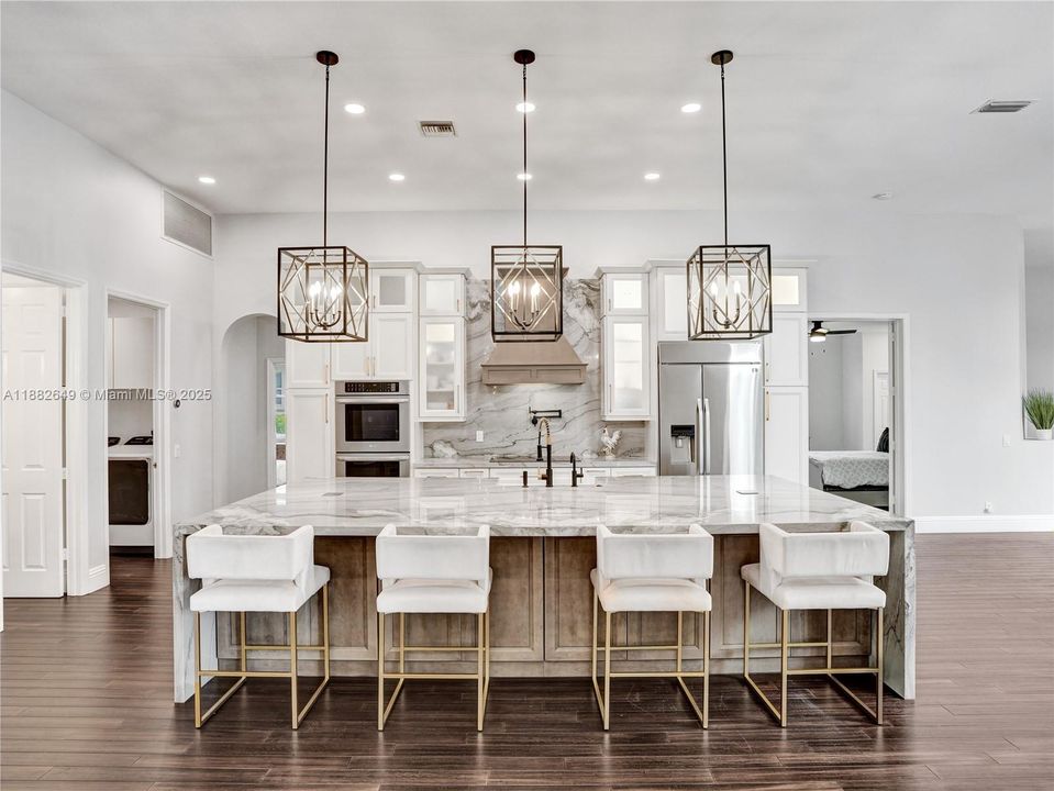 Spacious eat in nook with 4 barstools, but room for more!