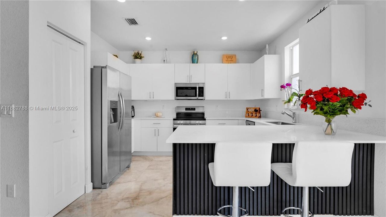 Upgraded porcelain tile flooring & LED-lit porcelain accent wall