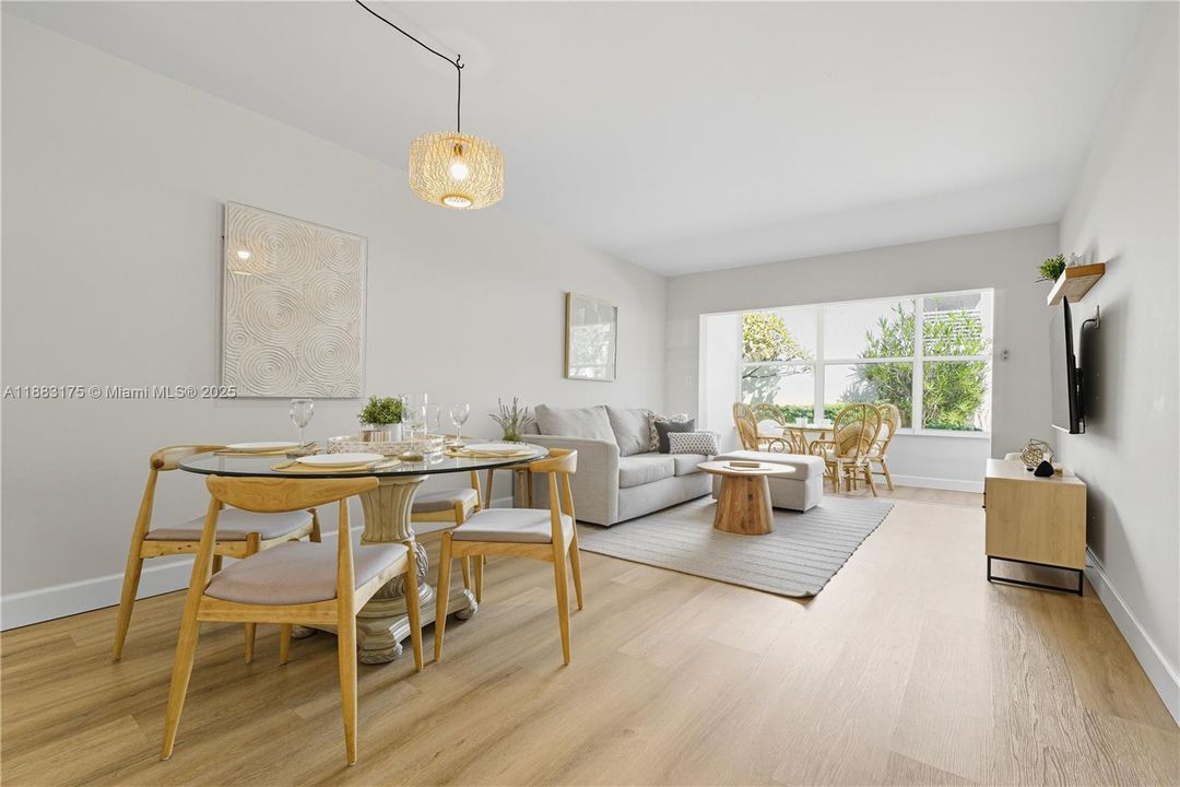 Dining table sits 4 and connects directly to the living room.