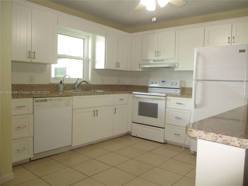 WHITE KITCHEN & APPLIANCES & WINDOW OVER SINK