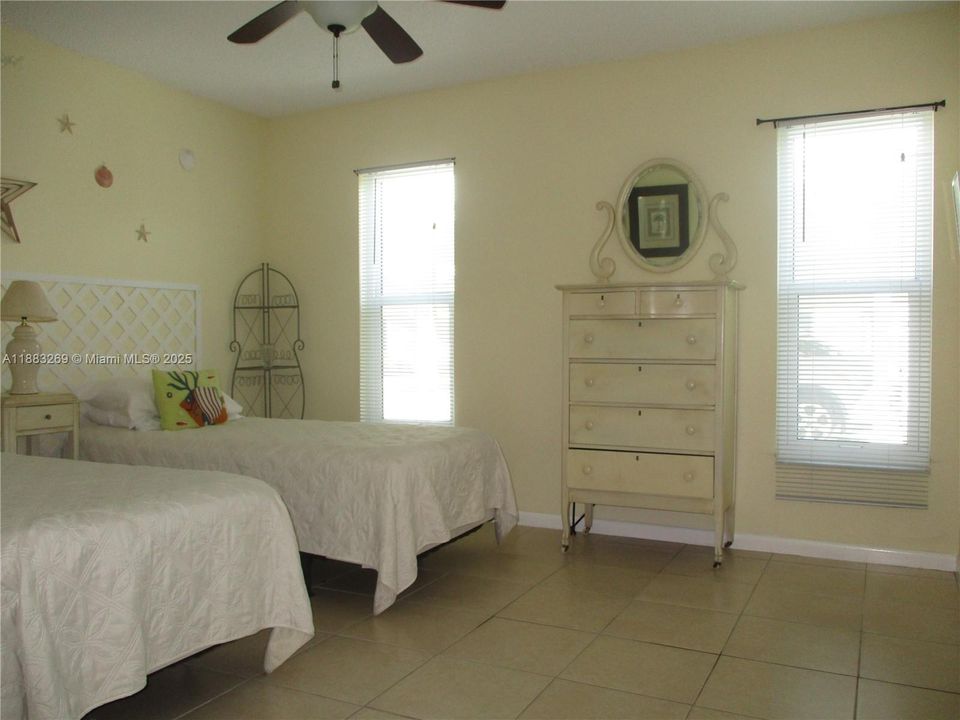 GUEST BEDROOM WITH TWO WINDOWS