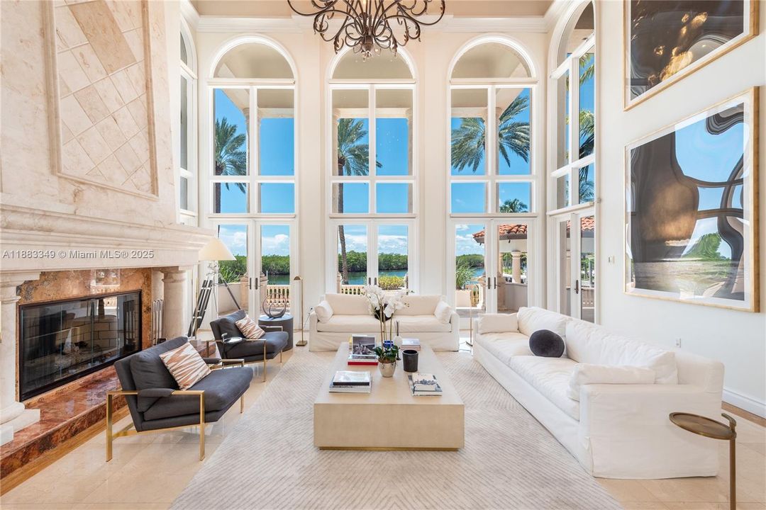 Soaring ceilings and a working fireplace make this room very special.