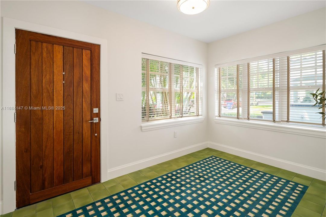 Bright Sunroom entry with Spanish encaustic tile