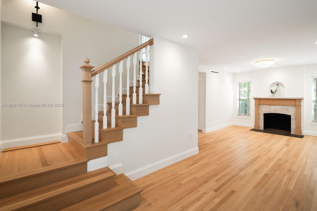 Solid Oak Floors with wood burning fireplace