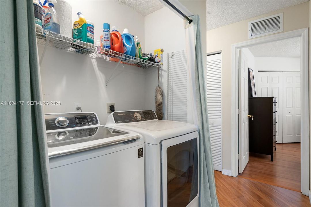 Upstairs laundry area with full-size washer & dryer.