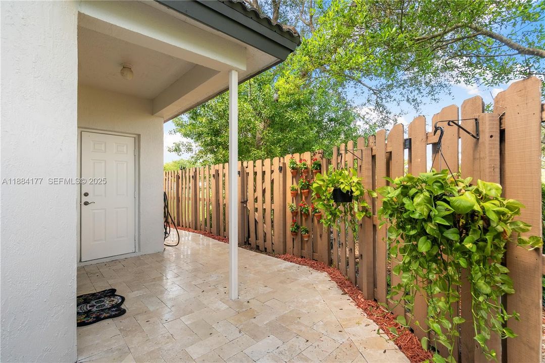 Patio includes a convenient storage room.