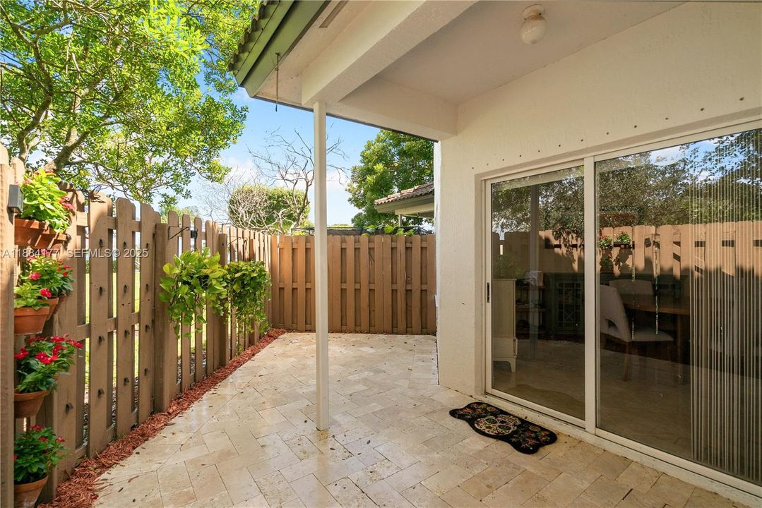 Covered patio with roof, perfect for BBQs.