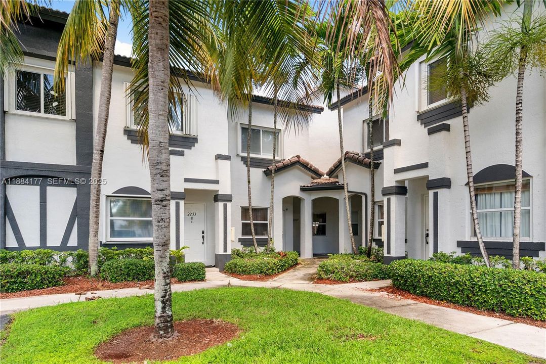 Corner Townhouse highlighted by privacy and beautiful surroundings.