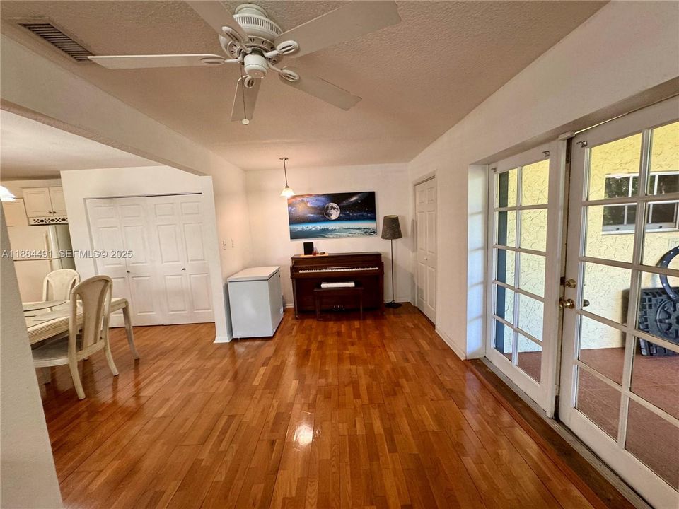 Huge living room, open to family room, open to dining room with covered screen patio at rear.