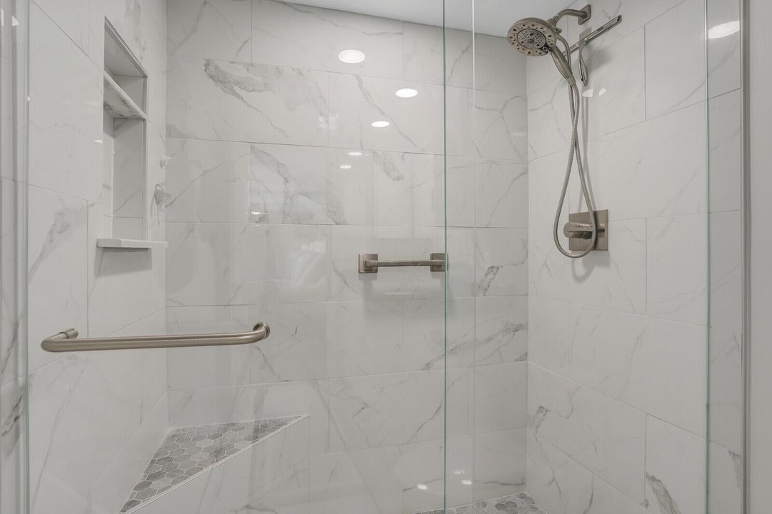 Primary shower with glass enclosure