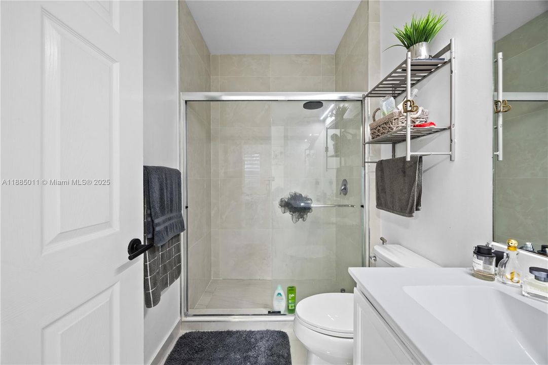 Remodeled bathroom with shower.