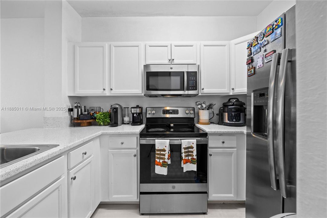 Kitchen with stainless steel appliances.