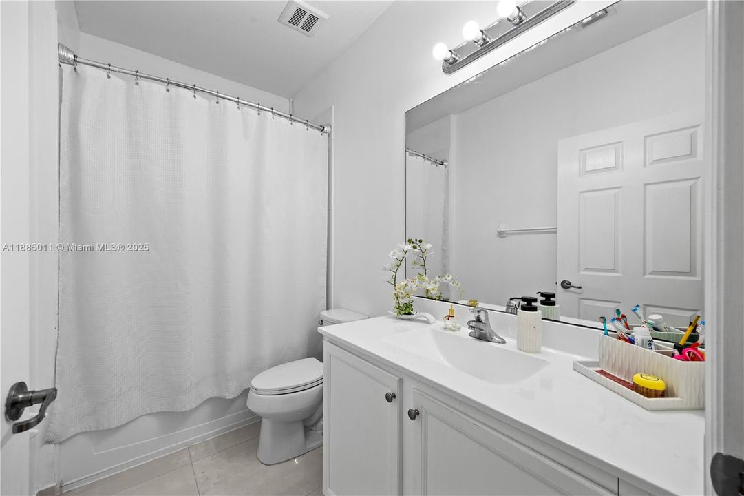 Remodeled bathroom with ample counter space.