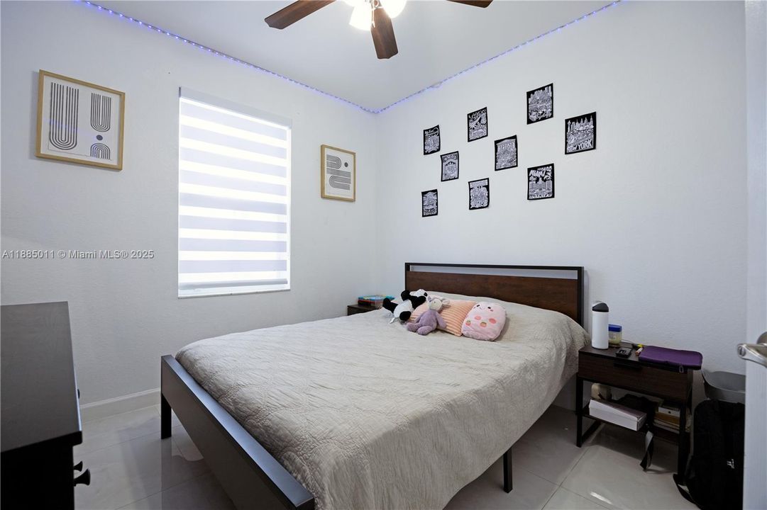 Bedroom with Zebra blinds.