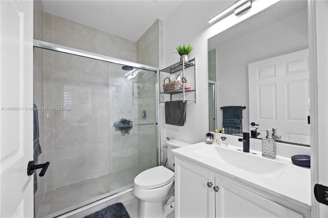 Remodeled bathroom with shower.