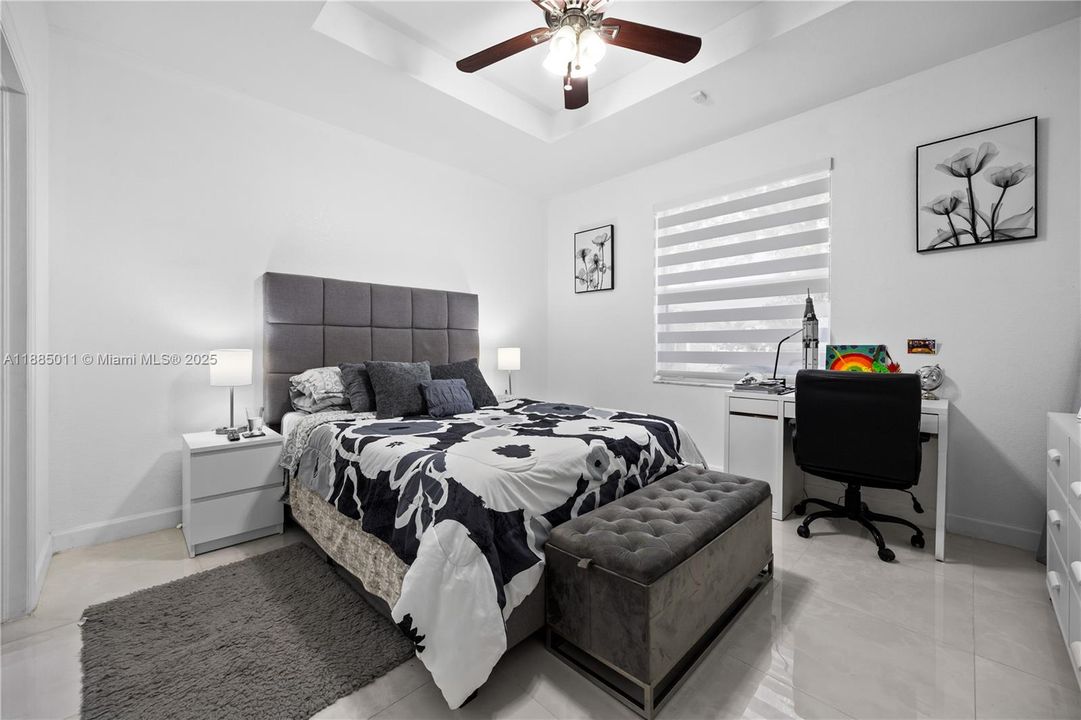 Bedroom with Zebra blinds.