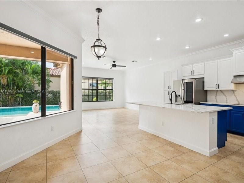 Spacious eat-in kitchen with a sunlit dining area