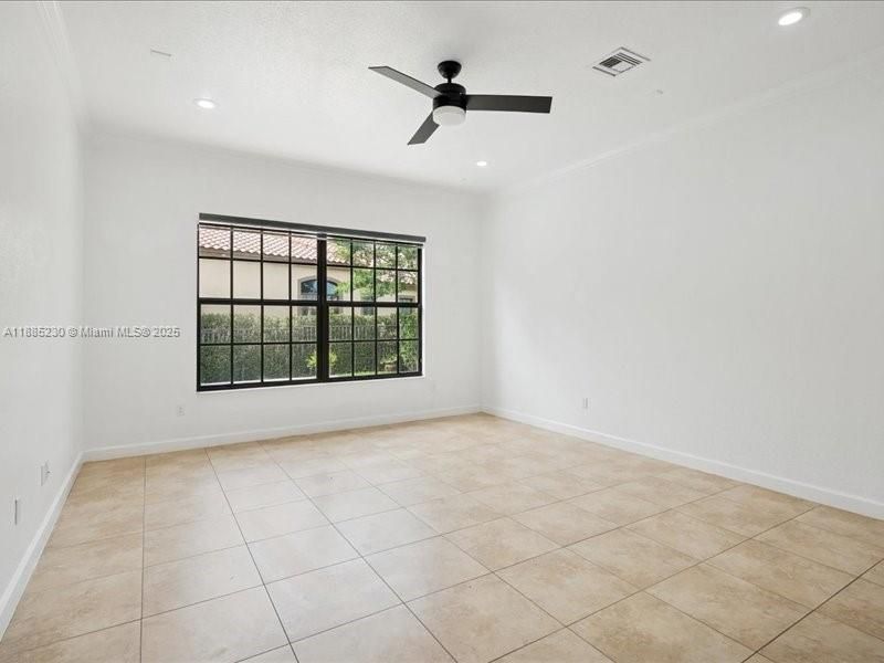 An open-concept family room with elegant sightlines to the chef’s kitchen and casual dining retreat.