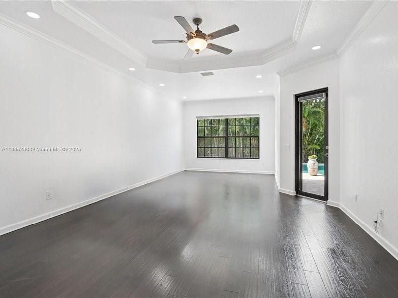 Expansive primary suite with a private sitting area, creating a serene retreat for relaxation