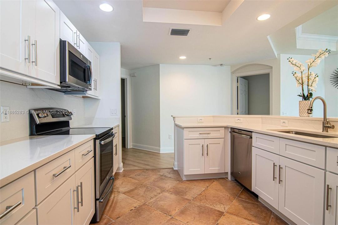 Tile in the bathrooms, den, and laundry.