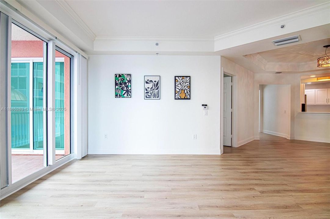 GREAT LIVING ROOM leads to WRAP-AROUND SCREENED BALCONY offering beautiful north views of the river & east views of the city.