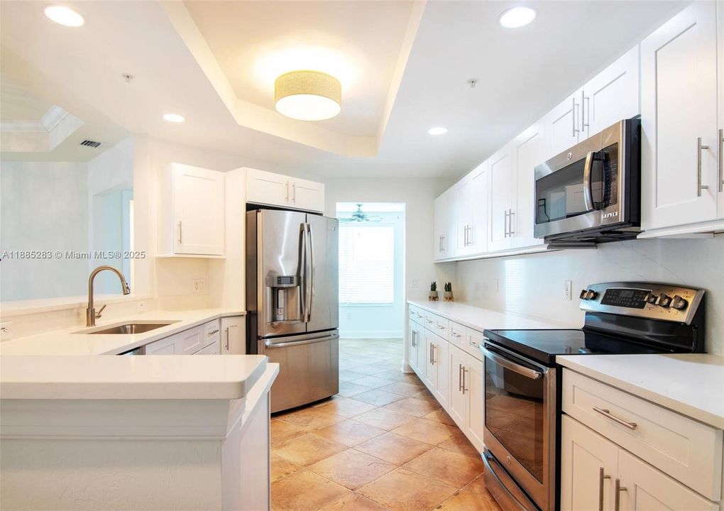 Enter this BEAUTIFUL END-UNIT CONDO from either YOUR PRIVATE or community ELEVATOR into spacious foyer conveniently located on 4th floor w/ ONLY TWO SETS OF STAIRS for those that enjoy counting STEPS!