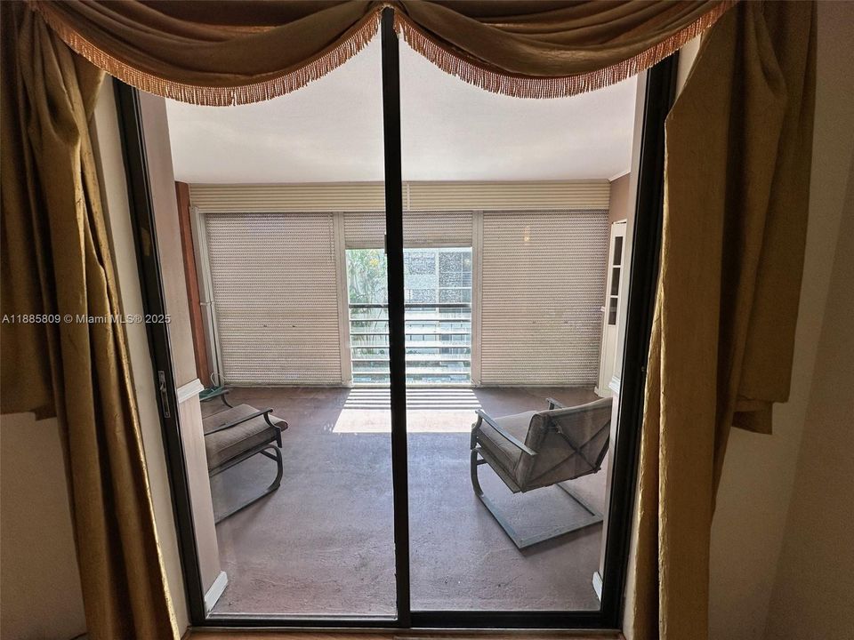 View from Primary Bedroom to Enclosed Terrace.