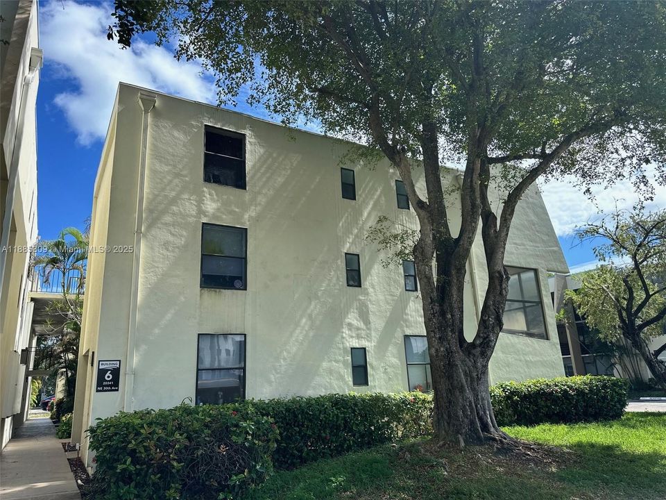View of a bedroom window from the sidewalk.