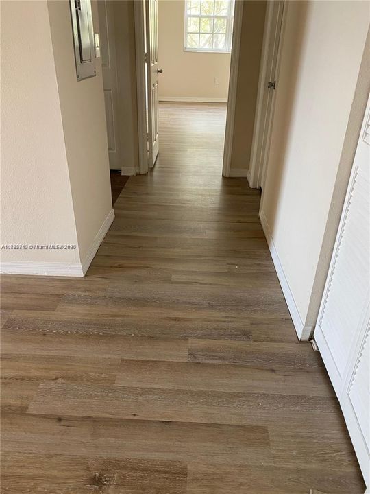 Hallway to Second Bed front, second Bath to the right, Kitchen to the left.