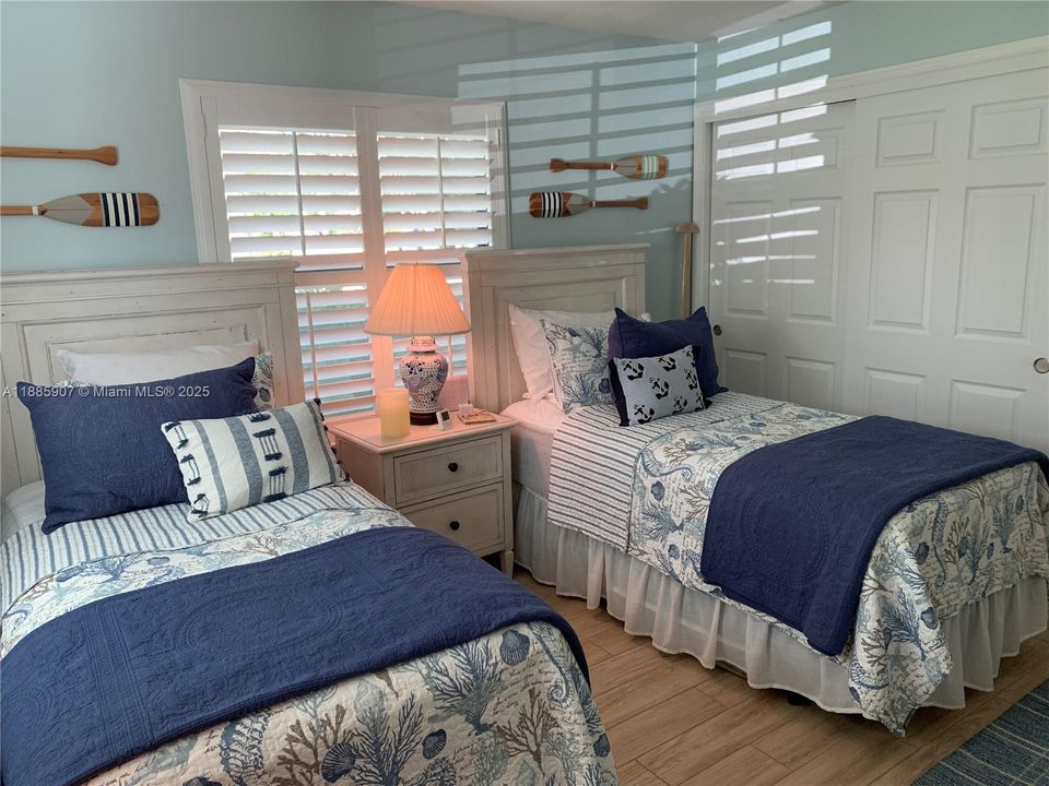 Guest Bedroom With Two Closets on Each Side of Room