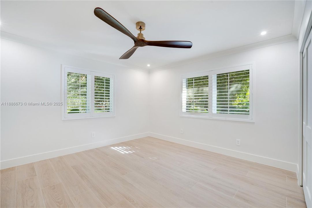 both first floor bedrooms have the same floors and window dressing