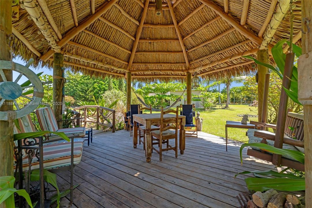 One of 2 tiki huts. This is the tiki adjacent to pool.