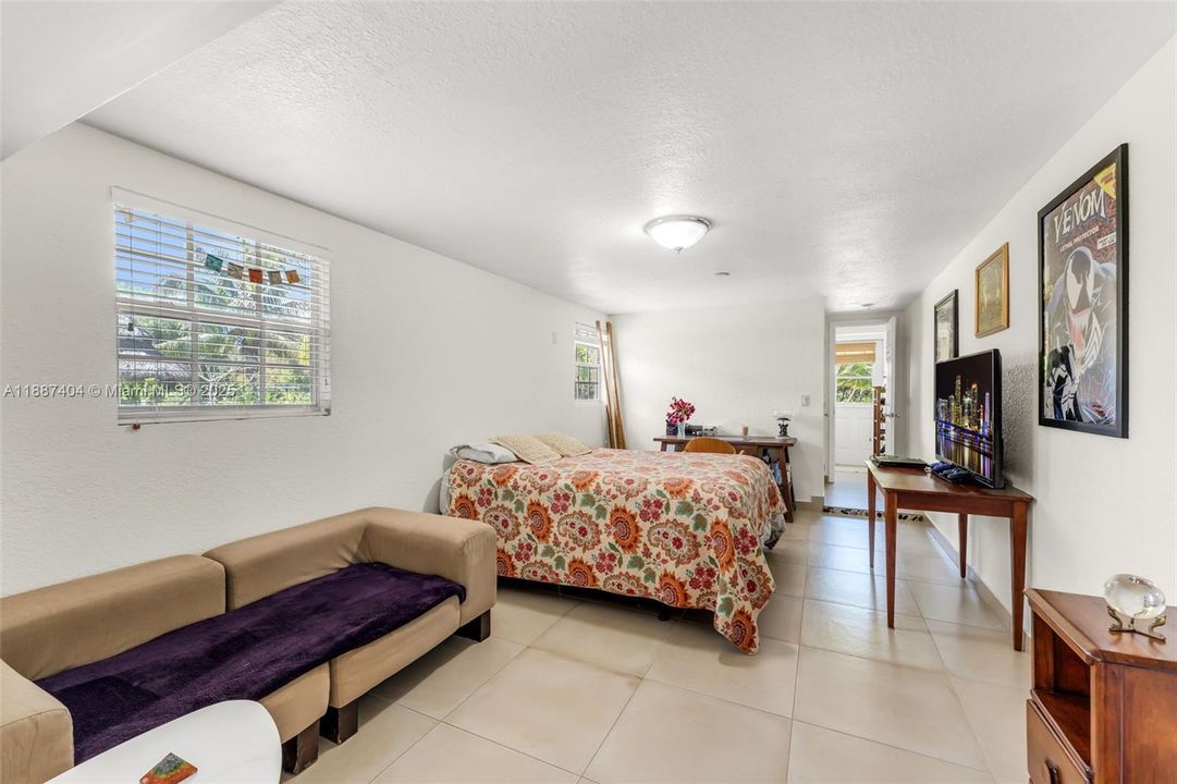 ANOTHER VIEW OF THE CABANA SUITE WITH FULL BATH AND EXTERIOR PRIVATE ENTRANCE AS WELL AS ACCESS FROM FLORIDA ROOM, SEEN IN PREVIOUS PHOTO.
