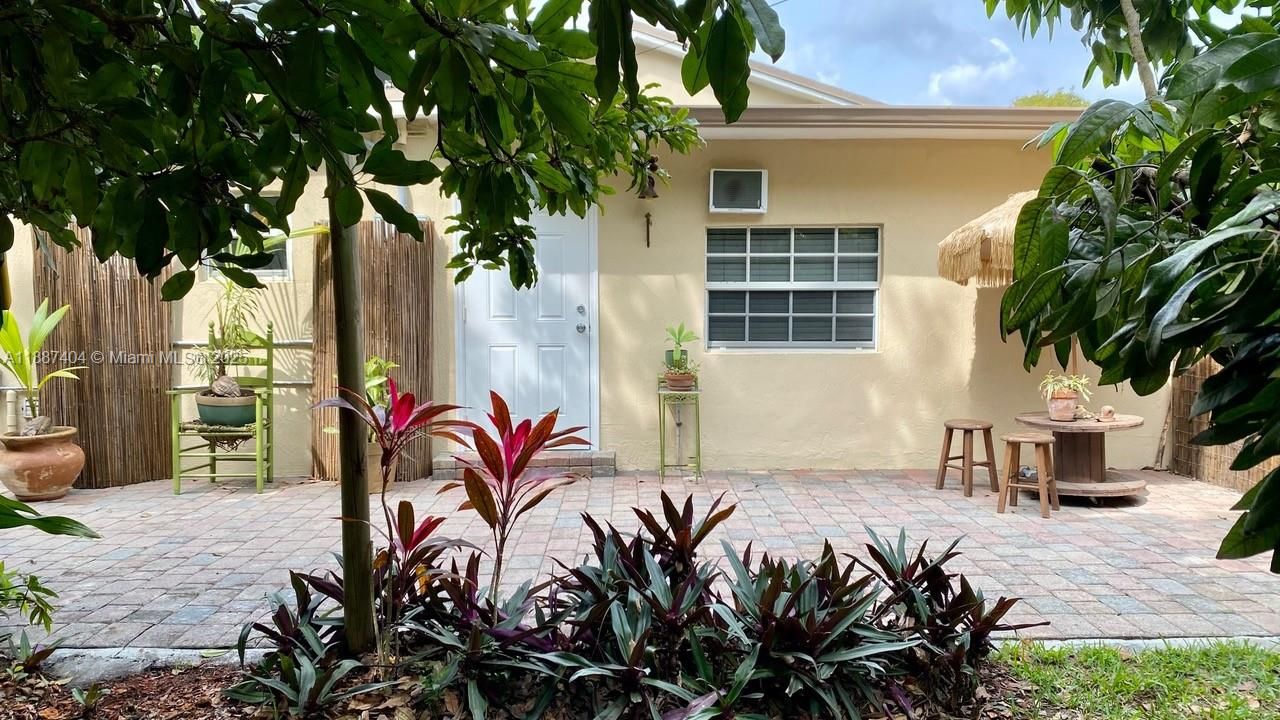 Private Entrance to the in-law suite of the house, with sitting area outside, also gives you access to the laundry room.
