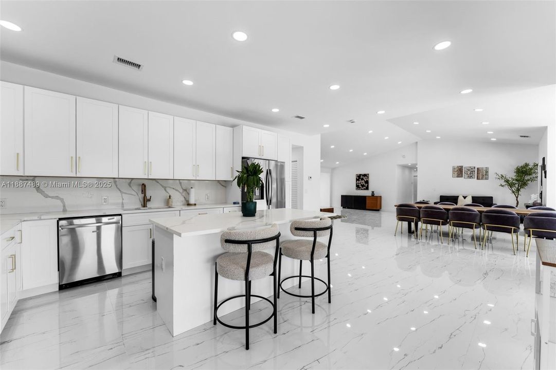 KITCHEN HAS A NICE VIEW OF OPEN LIVING /DINING YET OFF IN CORNER..