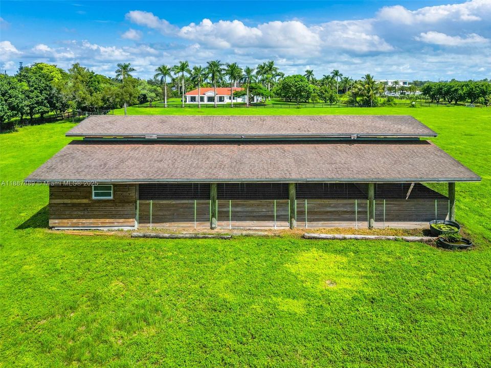 BARN W TACK & FEED ROOMS... CROSS FENCED  HAS RING, CHICKEN COOP. VIEW OF REAR HOME