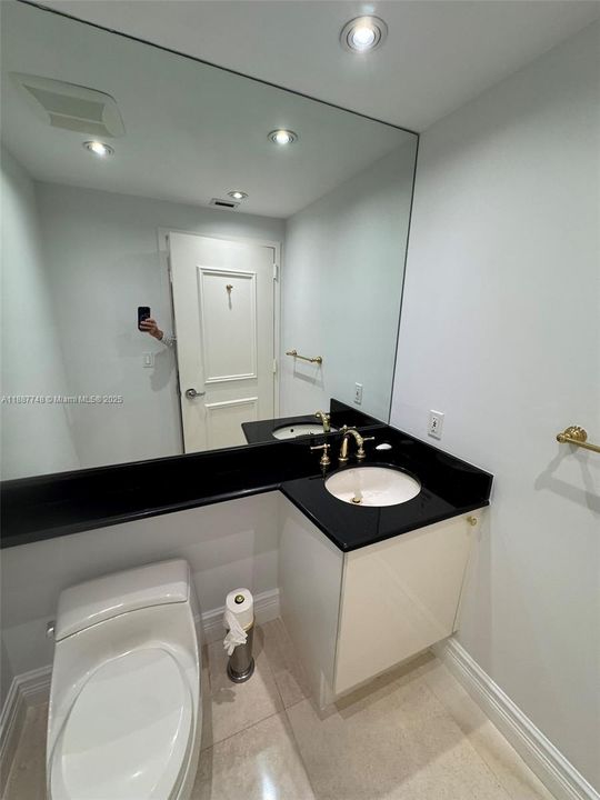 Half Bathroom at  entry foyer