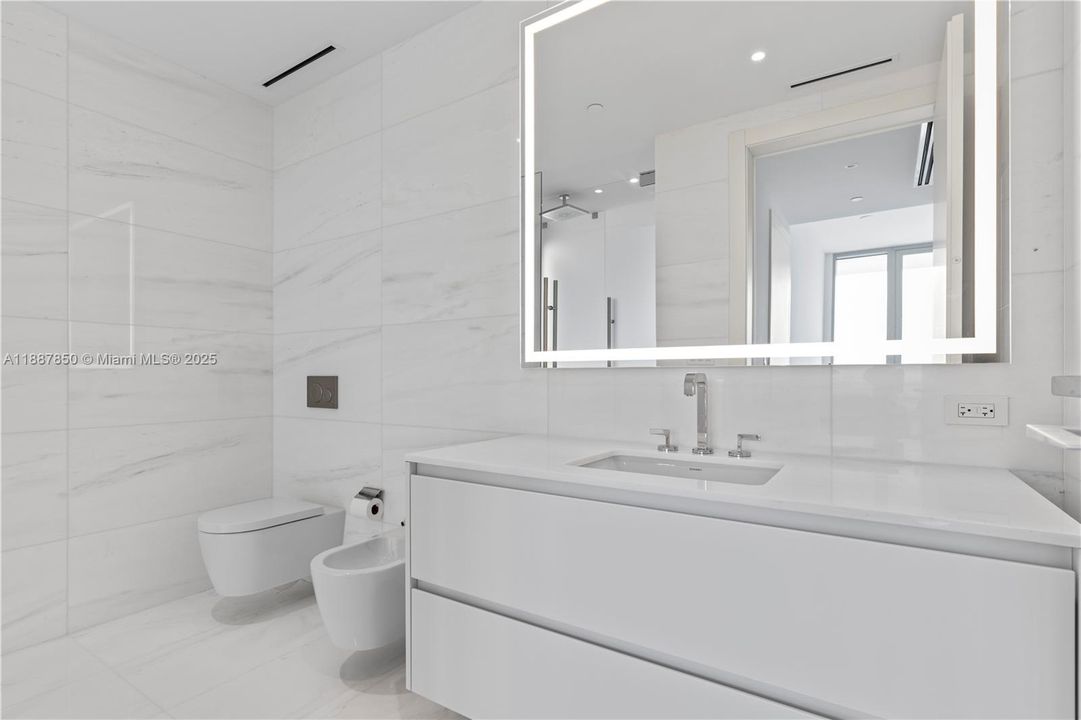 Primary Bathroom: His