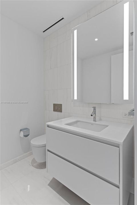 1/2 Bathroom by living area.